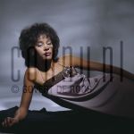 04-03-1985 Whitney Houston at studio in Amterdam, The Netherlands. March 04, 1985.

[keywords]Posed, Eye Contact, Dress[/keywords]